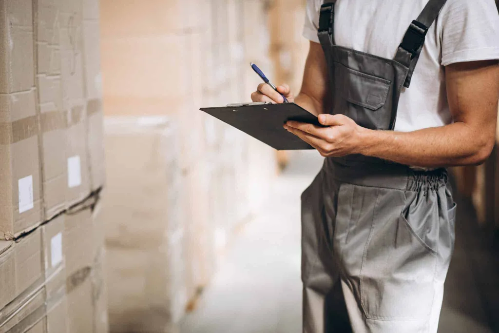 Young man working warehouse with